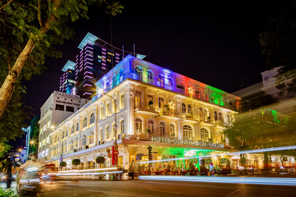 Vibrant night view of the iconic Hotel Continental Saigon in Ho Chi Minh City.
